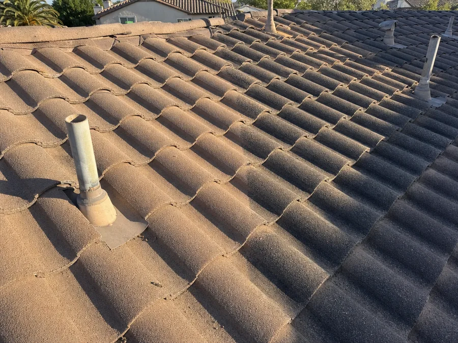 One roof plane where a less weathered patch of newer covering meets the original field